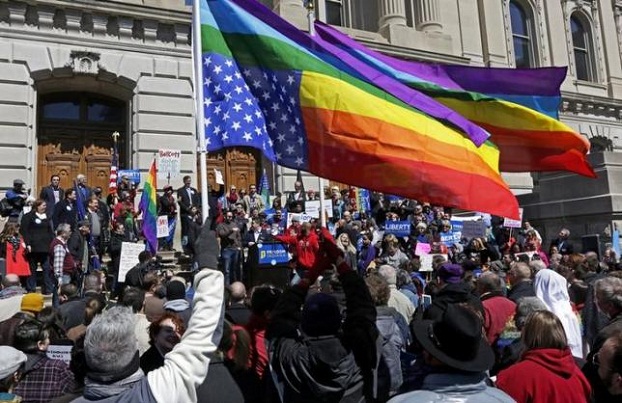 Demonstrators gather to protest a controversial religious freedom bill in Indianapolis